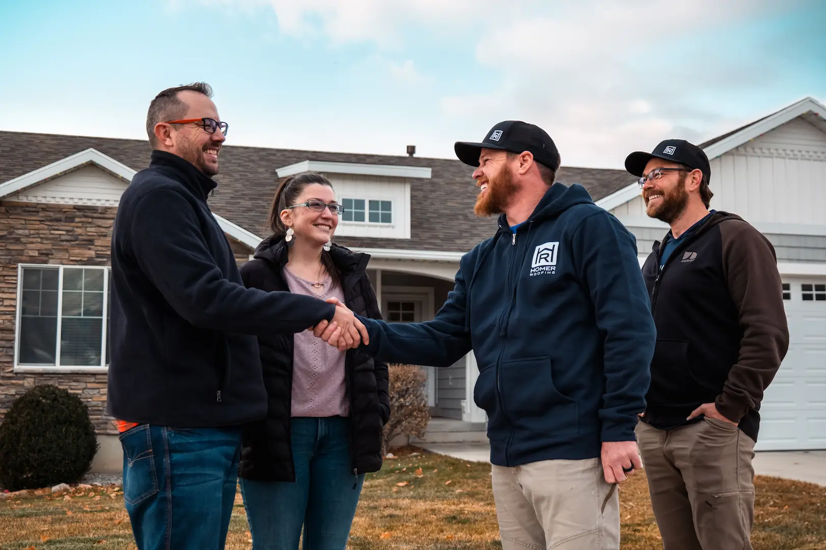 Homer Roofing team meeting with homeowners in Utah